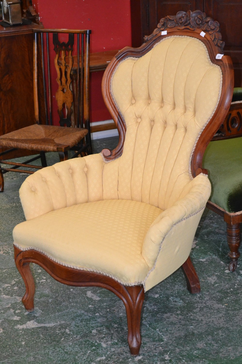 A Carlton McLendon furniture reproduction Victorian nursing chair, spoon back with foliate cresti