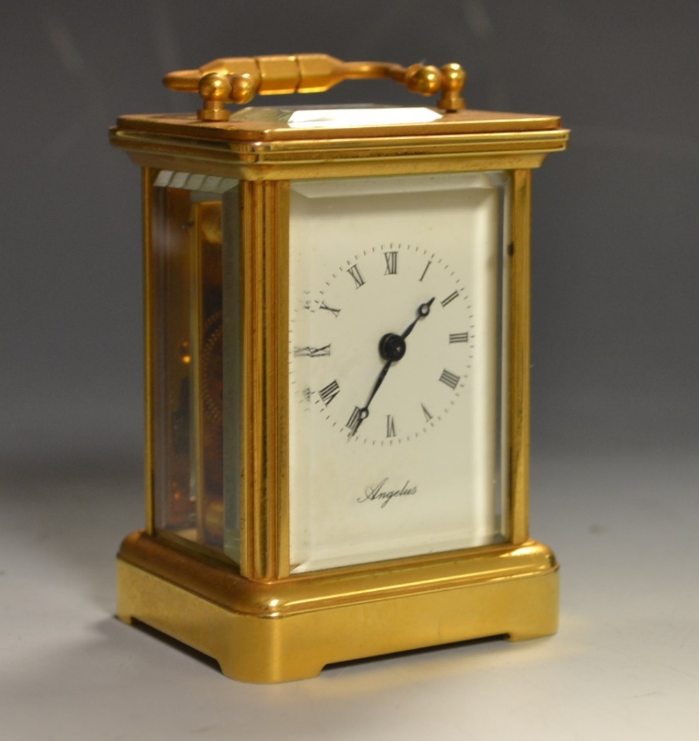 A miniature angelus brass cased carriage clock, white dial Roman