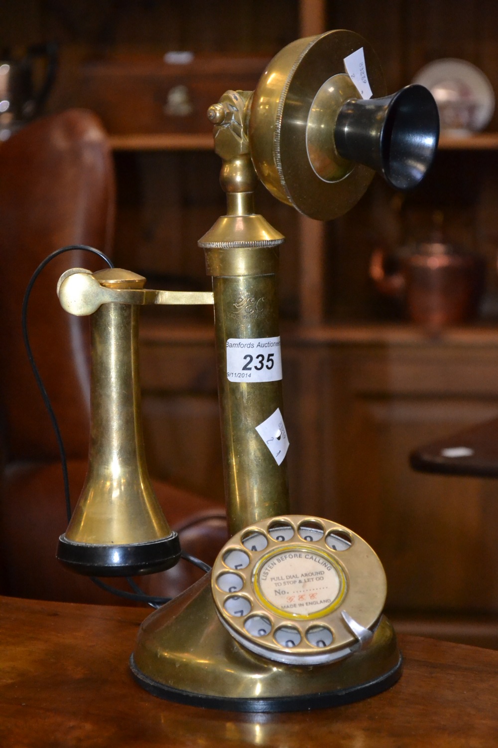 A reproduction brass candlestick telephone , marked GEC, 33.5CM high