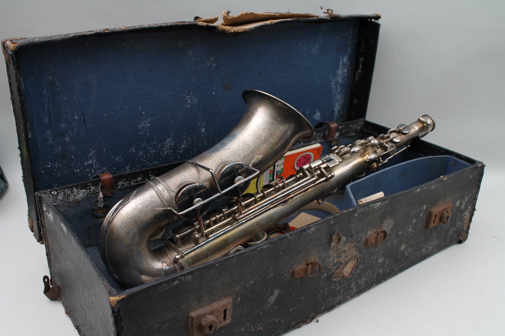 A silver plated saxophone, engraved for Rene Guenot Paris, in fitted case.