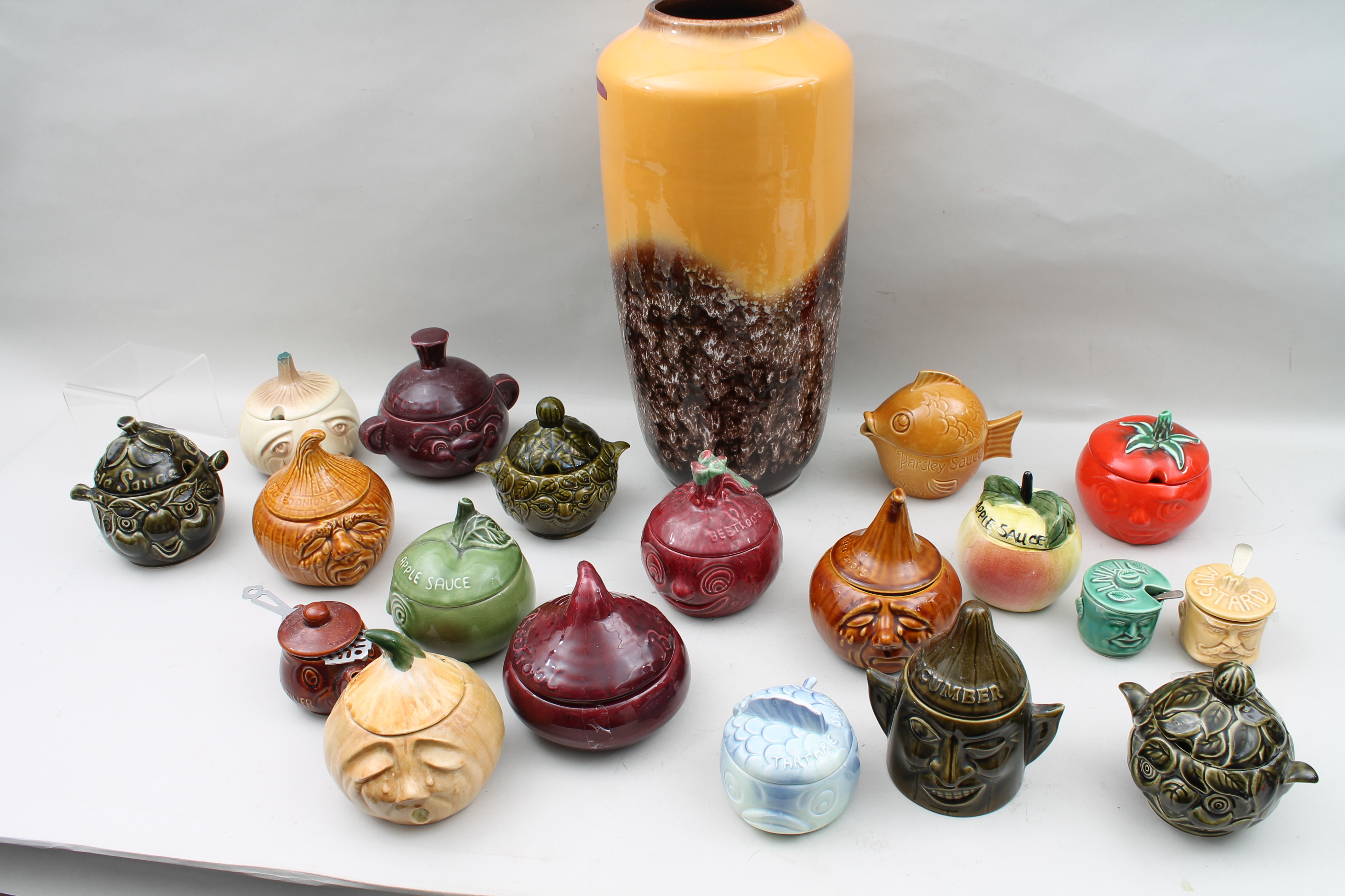 assorted Sylvac ,Sadler, etc face pots with lids together with