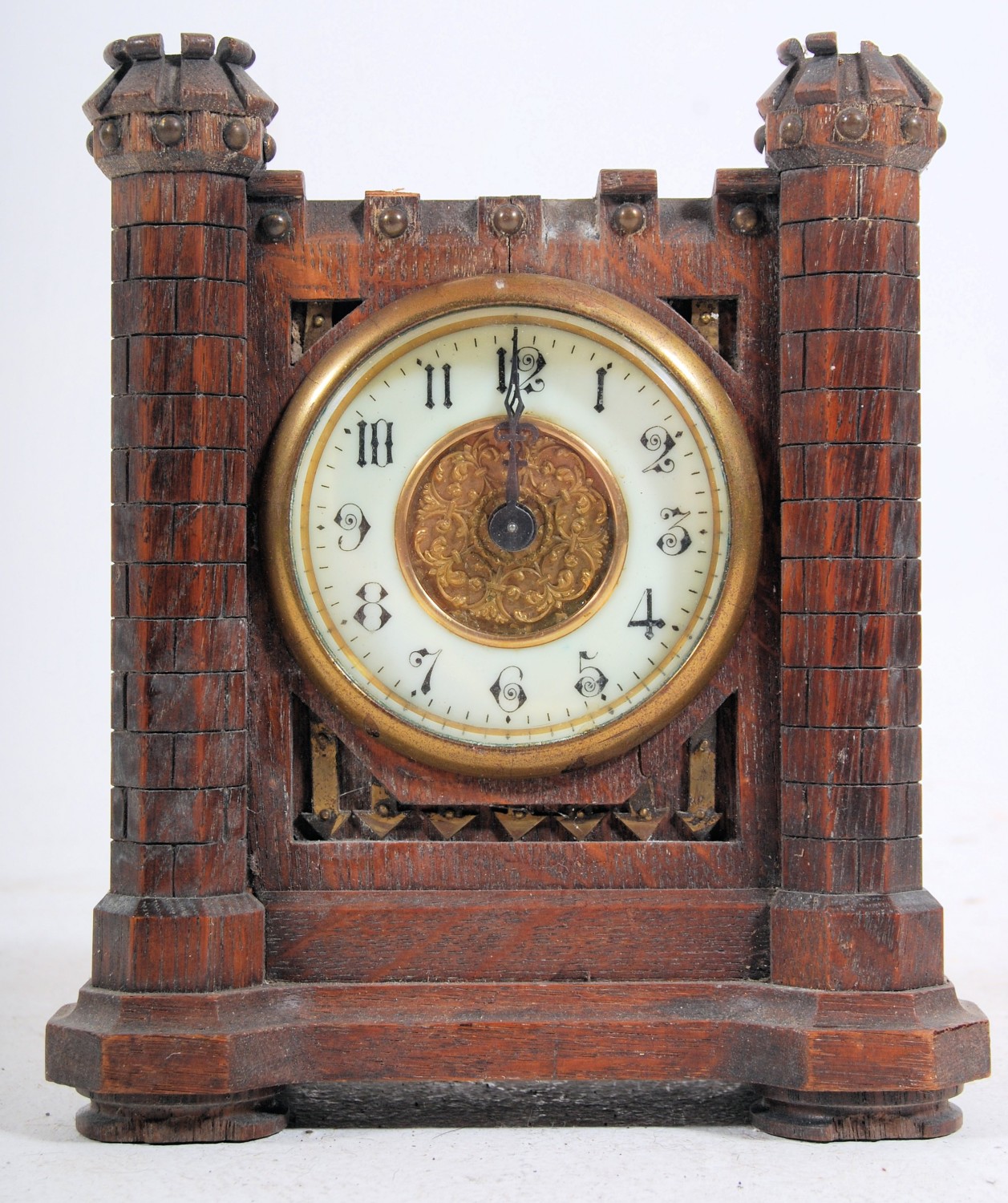 A 1920`s Junghans oak cased castle clock. The enamel face with brass