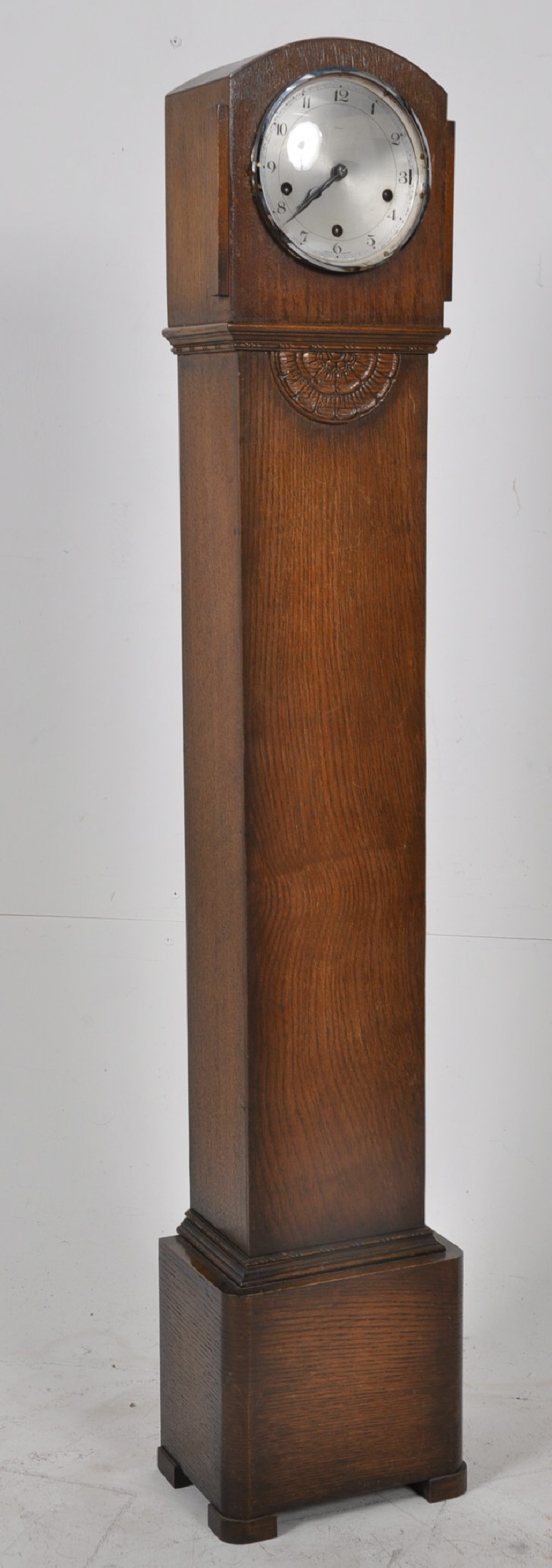 A 1930's Enfield oak cased granddaughter clock. The brass westminster