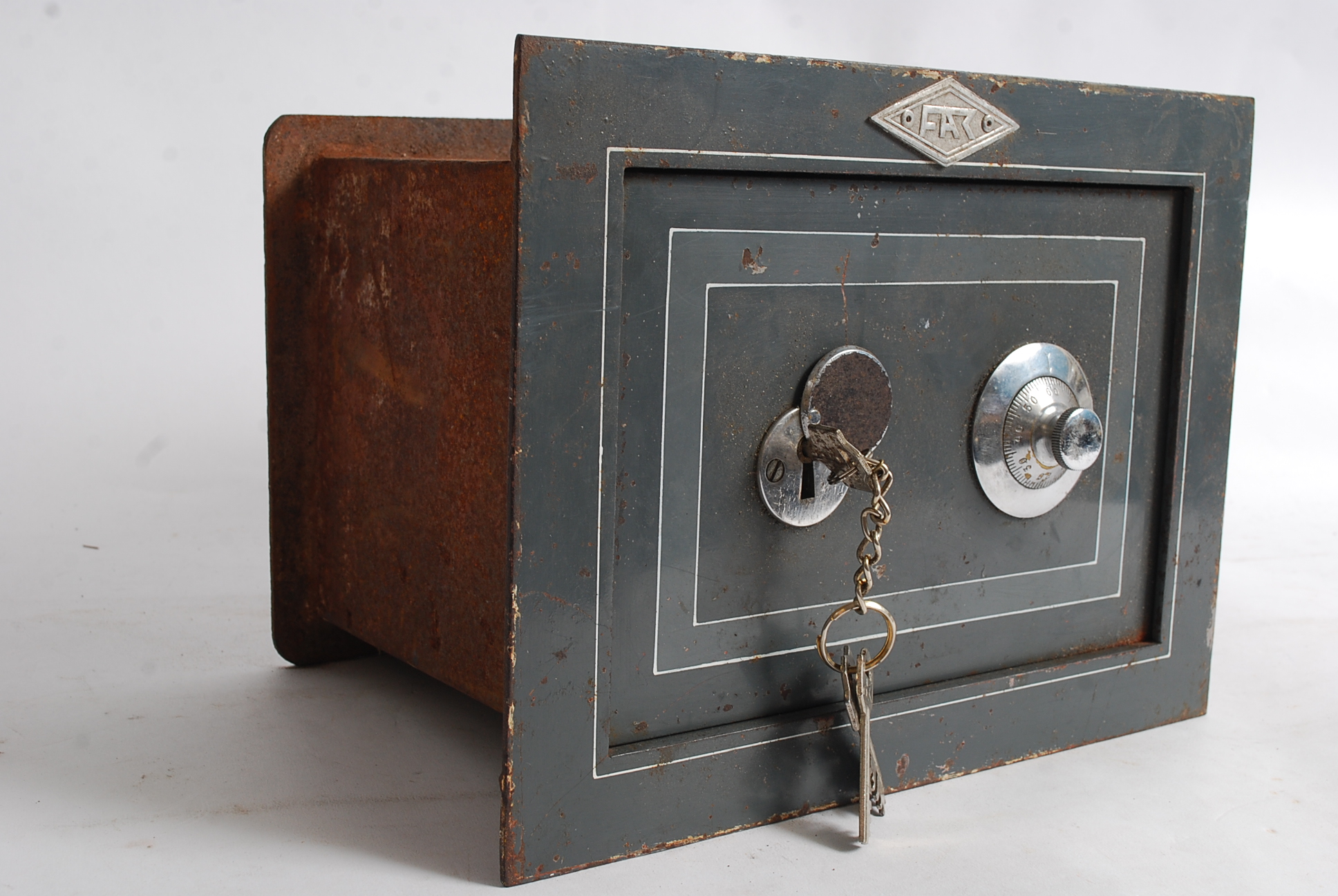 A vintage fak floor / wall safe with three keys and original instructions.