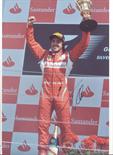 ALONSO FERNANDO: (1981- ) Spanish Formula One Motor Racing Driver, World Champion 2005 & 2006.