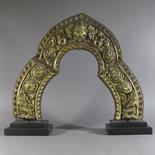 A COPPER GILT AUREOLE: Kathmandu Valley, Nepal, 18th century the repousse and chased relief in