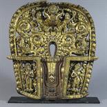 A COPPER GILT AUREOLE: Nepal, 16th century of horseshoe shaped form, the chased and repousse relief