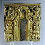 A COPPER GILT REPOUSSE FRAGMENTARY RELIEF: Tibet, 16th/17th century With central arched niche,