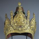 A RITUAL HEADDRESS: Mongolia, 19th century Repousse copper gilt, set with turquoises and coral, in