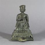 A BRONZE DONOR FIGURE: Nepal, 18th/early 19th century on single lotus openwork base, the nobleman