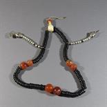 A BUDDHIST ROSARY (MALA): Eastern Tibet, Probably 19th century strung with black stone beads,