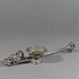 A PUJA BOWL AND SPOON: Tibet or Mongolia, 19th century silver, the bowl in the form of a double
