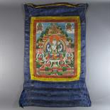 A THANGKA DEPICTING SADAKSARI: Mongolia, early 20th century Pigment with gold on cloth, silk mount,