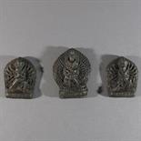 THREE SMALL VOTIVE PLAQUES (TSA TSA): Tibet, c.18th century moulded terracotta, the two smaller