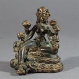 A BRONZE FIGURE OF VASUDHARA: Nepal, 15th century seated in lalitasana on a double lotus throne,