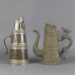 TWO TIBETAN BEER JUGS, 19th/20th century Each of tapered cylindrical form, one with brass repousse