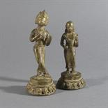 KRISHNA AND RADHA, Nepal, 19th century Bronze, each standing on an openwork lotus base, Krishna