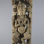 A CARVED WOOD ARCHITECTURAL STRUT, Nepal, circa 17th century Depicting a dakini, the dancing