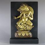 A HORSE-HEADED DEITY, Tibet, 18th-19th century Copper-gilt repousse relief, the dancing figure