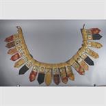 A TEMPLE HANGING, Tibet, 19th century composed of a row of nineteen tsaklis mounted on cloth, each