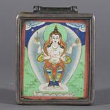 AN AMULET BOX (gau), Tibet, 19th century Silver and brass, painting on cotton with mineral pigments