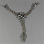A LADY`S BELT ORNAMENT, Tibet, 19th century Silver with turquoise inlay, the central openwork