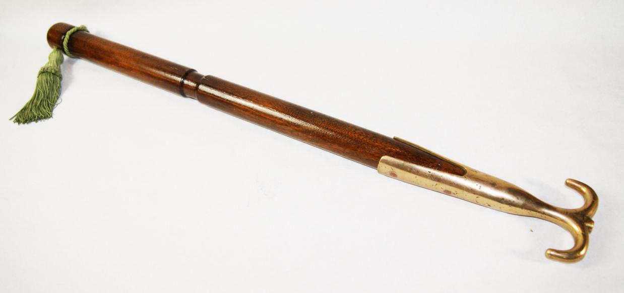 Old bronze boat hook, double ended and reshafted in mahogany for