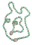 COLLANA E BRACCIALE COMPOSTI DA DUE FILI DI GIADE a sfera alternate da sfere in argento traforato,
