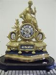 19c gilt bronze and ormolu French mantle clock with Classical bronze figure to top, Sevres porcelain