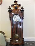 Vienna Regulator wall clock with an 8 day timepiece, decorative walnut and ebonises case with glazed
