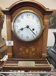 Oak Edwardian period arched topped Bracket clock with an 8 day timepiece striking on a gong,