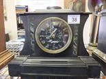 Marble mantle clock with an 8 day French movement by Dewint striking on a bell. gilt highlighted