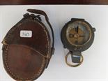 Negretti and Zambra London a military pocket compass in leather case, gilt brass highlights