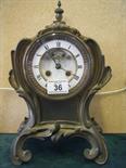 Ornate mantle clock Art Nouveau design with an 8 day movement striking on a bell visible escapement,