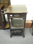 Art Nouveau design mahogany side table with a single small drawer, above a shelf with a small