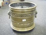 Late 19c brass log basket, on tripod feet with Lion head handles, 16" tall 12" wide,