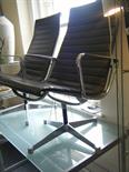 Genuine Charles & Ray Eames easy lounge chair with chrome highlights to arms, base and supports,