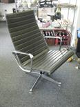 Genuine Charles & Ray Eames easy lounge chair with chrome highlights to arms, base and supports,