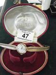 Ladies Vintage Omega 9ct gold watch and strap, chain link strap leading to a circular dial with