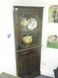 Oak freestanding corner cupboard with glazed doors to the top all above 2 cupboards 5` tall approx