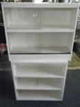 White painted pine open bookcase and a similar white painted two section show cabinet, both 2`6