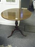 Georgian period mahogany circular topped snap top table, on tripod pad supports,