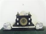 Art Deco period 3 item clock garniture architetchered centre clock with an 8 day timepiece to the