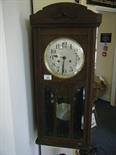 1930`s oak wall clock 8 day movement striking on a gong, appears to be working