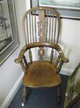 Elm seated high bow backed chair on turned support, spoke back decoration to the top