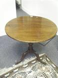 Georgian period mahogany circular topped snap top table, on tripod pad supports,