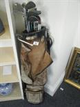 Bag with old golf clubs enclosed,