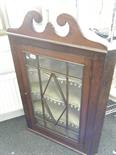 Georgian period wall hanging corner cupboard with a single glazed door to front (one glass panel