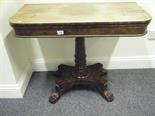 William 1V Early 19c mahogany flip top Tea table, on a platform base containing 4 hairy Paw feet