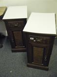 Pair of handed walnut bedside cupboards, each with a single door and drawer on a plinth base,